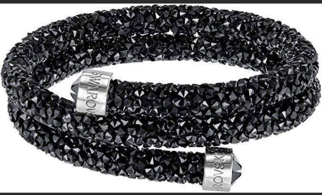 Swarovski Crystal Black Wrap Bracelet (Category: Bracelets) located in Angeles City. Submitted by brea.alexandria (Listing ID 1466073250, Image 1). Description: - Authentic Swarovski black crystal wrap bracelet - Versatile double strand design with sparkling crystal rocks - Silver-tone end caps featuring Swarovski lettering - Excellent overall condition - Includes original blue presentation box, gift bag with silver ribbon, and certificate of aut