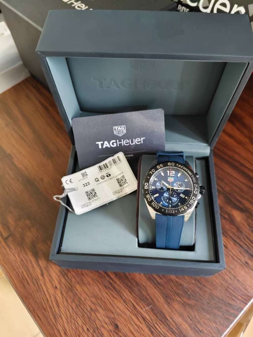 TAG Heuer Formula 1 Blue Chronograph Watch (Category: Luxury Watches) located in Quezon City. Submitted by shilpamour86508 (Listing ID 1466012299, Image 1). Description: - Authentic TAG Heuer Formula 1 Quartz Chronograph - Stunning deep blue dial with a matching textured blue rubber strap - Black tachymeter bezel, three functional subdials, and date window at 4 o'clock - Flawless, scratch-free sapphire crystal - Excellent condition with only mini