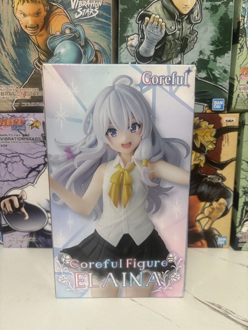 Taito Coreful Figure Elaina Wandering Witch (Category: Figurines & Statues) located in Mandaluyong City. Submitted by jb_toys (Listing ID 1466022874, Image 1). Description: - Character: Elaina - Line: Taito Coreful - Appearance: White shirt, dark skirt, yellow ribbon, long grey-white hair, and purple eyes - Packaging: Includes original box - Condition: Authentic and well-kept.
