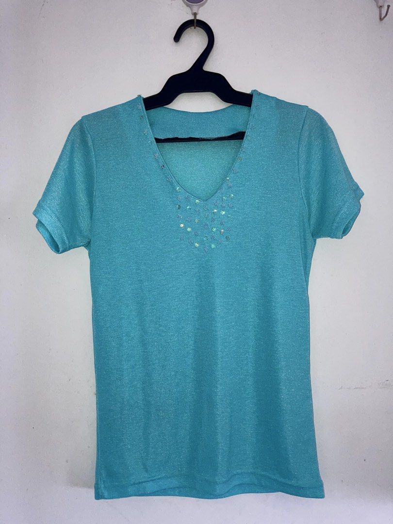 Teal v-neck shirt with sequin embellishment (Category: Shirts) located in Daraga. Submitted by nanasnonsense (Listing ID 1466123468, Image 2). Description: PROMO! BUY 9 FOR 500 + GET 1 FREE - applicable for PHP 79 tops and/or dresses from my listings - choose free item from free pile Items are all preloved or thrifted so please manage your expectations. Thank you!.
