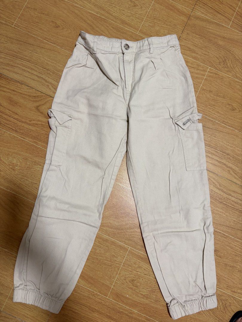 Terranova Beige Cargo Pants Size 12/13 (Category: Jeans) located in Taguig. Submitted by sassie_94 (Listing ID 1466096189, Image 1). Description: - Brand: Terranova - Color: Classic beige - Size: Age 12/13 (Height 152/158) - Fit: High waist with button closure and comfy elastic back waistband - Details: Functional side pockets on both legs and trendy elastic ankle cuffs - Condition: Excellent pre-loved condition .