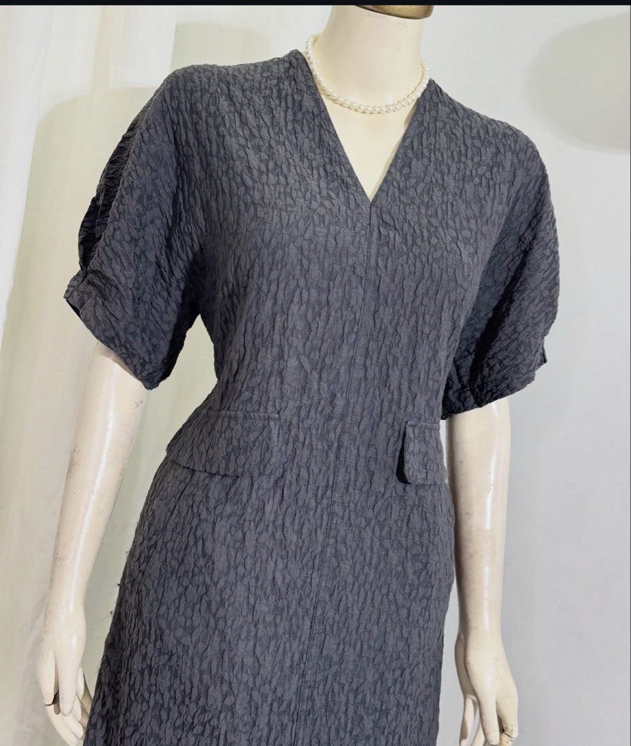 Textured Dark Grey Dress (Category: Dresses) located in Las Pinas. Submitted by paasagirl (Listing ID 1466136192, Image 2). Description: Bust: 38-42 Waist: 30-40 Length: 48 - Brand: Beauty & Youth United Arrows (High-quality Japanese brand) - Color: Dark grey - Style: Midi length dress with a structured silhouette - Details: Unique textured fabric, V-neckline, short sleeves, and front flap pockets - Condition: Excellent staple piece for everyday 
