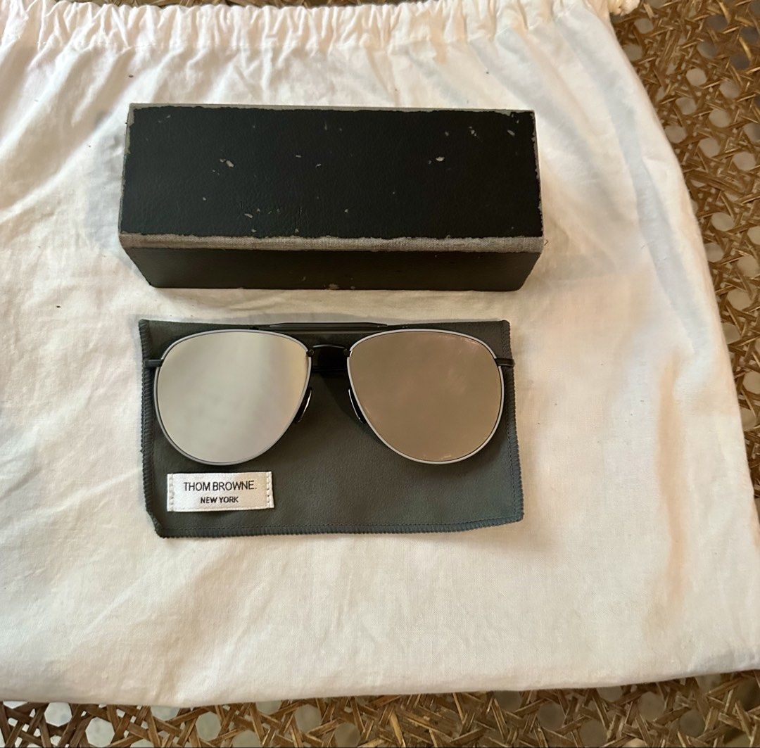 Thom Browne TB-015 LTD Black Grey Sunglasses (Category: Sunglasses & Eyewear) located in Makati City. Submitted by luchingching (Listing ID 1465993271, Image 2). Description: - Brand: Thom Browne - Model: TB-015 Aviator Sunglasses - Color: Black frame with dark grey lenses (subtle mirrored finish) - Design: Double bridge with signature tricolor red, white, and blue temple tips - Craftsmanship: Premium Japanese made luxury eyewear - Inclusions: Or