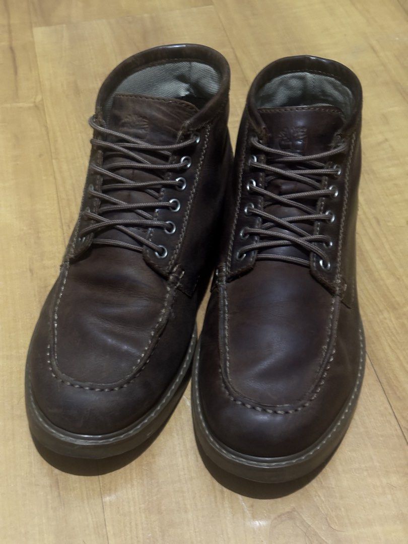 Timberland Moctoe Boots Dark Brown (Category: Boots) located in Manila. Submitted by knshkho (Listing ID 1466087647, Image 1). Description: - Brand: Timberland - Color: Dark Brown - Material: Premium Leather (nubuck) with ReBOTL fabric lining - Design: Moc toe with matching laces and metal eyelets - Details: Debossed tongue logo and heel stamp - Origin: Made in Portugal - Condition: Excellent, well-maintained - repairs done: restitched sole, inso
