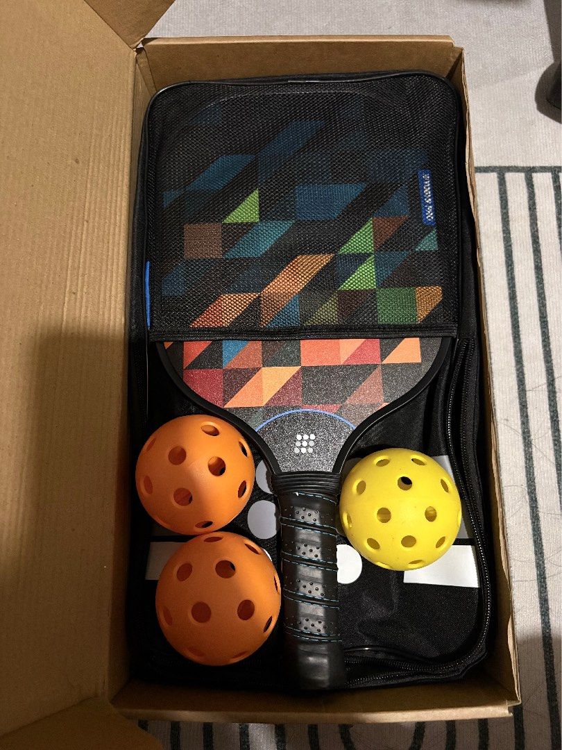 Tobys Pro Fiber Pro 1000 Pickleball Set (Category: Racket and Ball Sports) located in Plaridel. Submitted by thefatbearinside (Listing ID 1466042183, Image 1). Description: - Brand/Model: Tobys Pro Fiber Pro 1000 Pickleball Set - Paddle Weight: Ultra-lightweight at 206g each for effortless swings - Material: Durable fiberglass face with USAPA standard pickleballs - Design: Eye-catching geometric pattern in blue, orange, black, and green - Complet