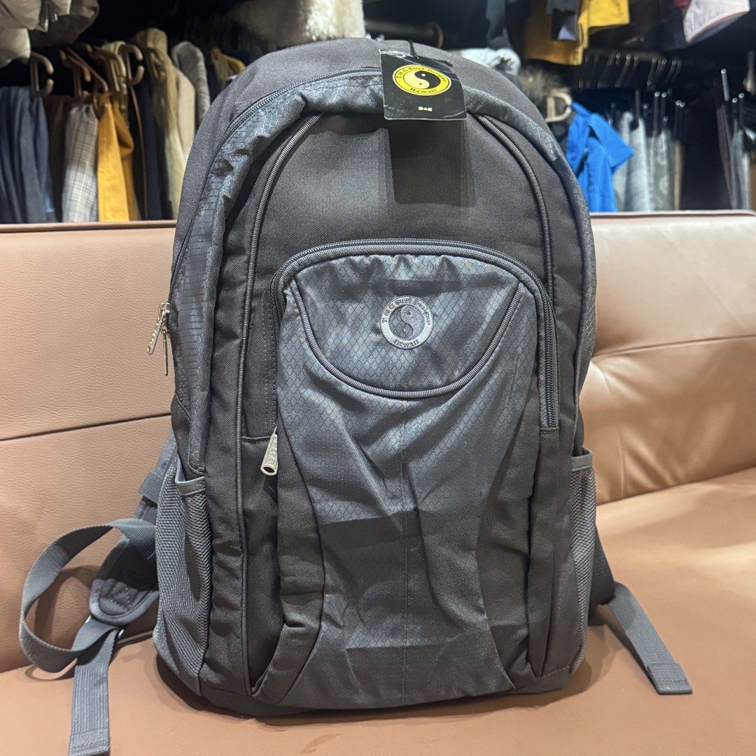 TOC Surf Designs Hawaii ACE Co. Ltd. Backpack Grey (Category: Backpacks) located in Rizal. Submitted by houseofbell (Listing ID 1466150677, Image 1). Description: - Brand: TOC Surf Designs Hawaii (ACE Co. Ltd.) - Color: Grey with stylish geometric pattern on the front pocket - Comfort: Padded adjustable straps with secure sternum clip - Storage: Spacious main compartment, light grey interior with open slip pocket, and convenient mesh side pockets