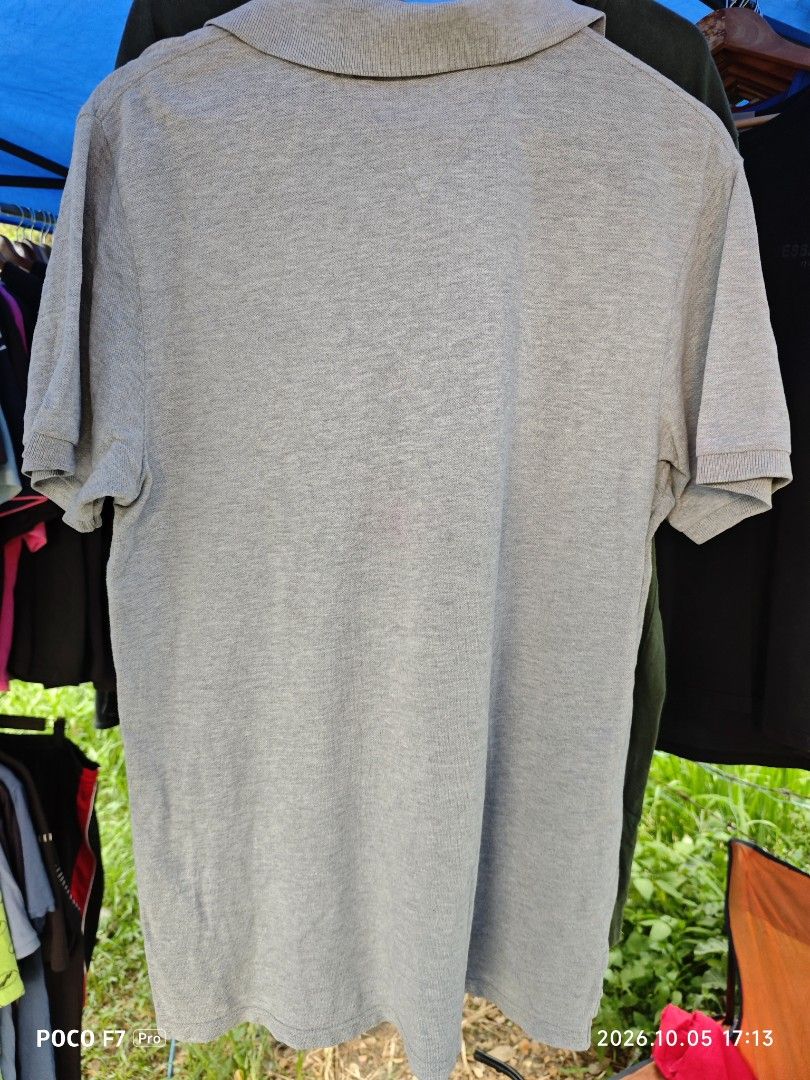 Tommy Hilfiger (Category: Activewear) located in Mexico. Submitted by josephnuqui1980 (Listing ID 1466133326, Image 3). Description: Grey Tommy Hilfiger stretch-cotton pique polo shirt featuring a "TH 54 County 1954" chest crest and "Hilfiger" embroidery. • Brand: Tommy Hilfiger • Color: Grey (Cloud Heather/Melange) • Details: • Left-chest embroidered crest with "TH 54 County 1954" and USA flag motif • Red "Hilfiger" script embroidery near the he