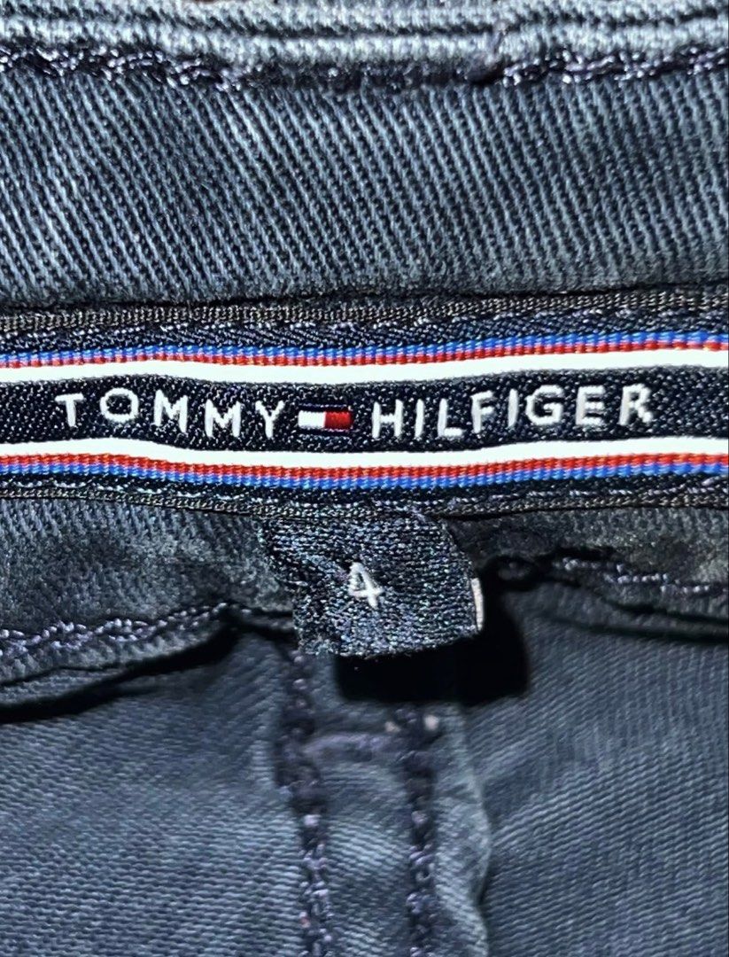 Tommy Hilfiger Dark Gray Jeans Size 4 (Category: Jeans) located in San Mateo. Submitted by cam__cao (Listing ID 1466033360, Image 2). Description: - Brand: Tommy Hilfiger - Color: Dark gray with a subtle washed finish - Size: 4 - Cut: Straight silhouette - Details: Classic five-pocket style, branded metal button closure, and leather logo patch - Condition: Excellent, perfect for everyday casual outfits •Button is a bit worn from use, but still fi