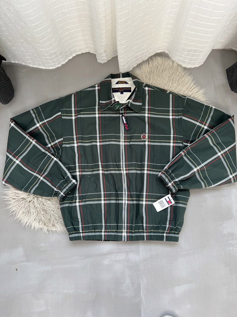 Tommy Hilfiger Golf Plaid Zip Jacket (Category: Coats, Jackets and Outerwear) located in Binan City. Submitted by finders_market (Listing ID 1465962516, Image 1). Description: - Brand: Tommy Hilfiger Golf - Style: Green plaid zip jacket with white contrast collar - Size: Men's Small - Material: 100% Cotton, Made in Malaysia - Details: Embroidered crest logo, branded zipper pull, two front pockets, elastic cuffs and hem - Condition: Brand new with