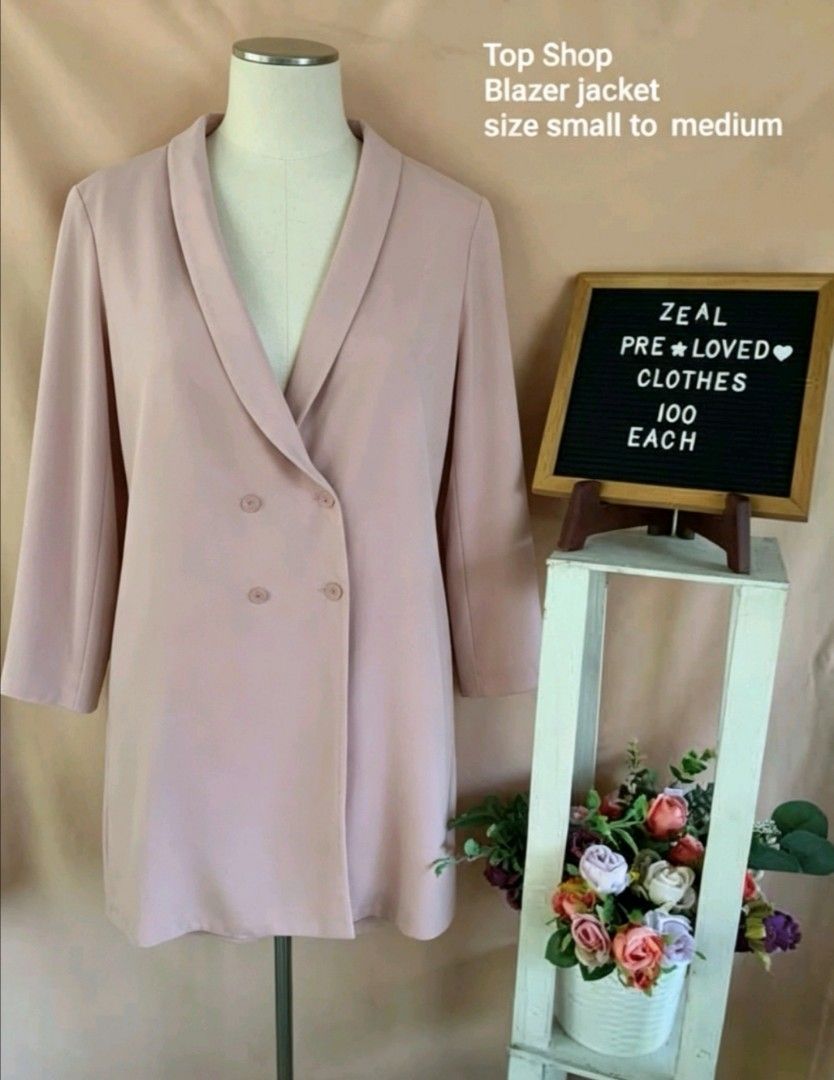 Top Shop Blazer Jacket Pink Size Small to Medium (Category: Coats, Jackets and Outerwear) located in Manila. Submitted by charlottej01596 (Listing ID 1465972632, Image 1). Description: - Brand: Top Shop - Color: Pastel Pink - Style: Double-breasted with four matching buttons, shawl lapel collar, and relaxed longline fit - Fabric: Lightweight and comfortable - Size: Fits small to medium frames easily - Versatility: Great for layering over basic to