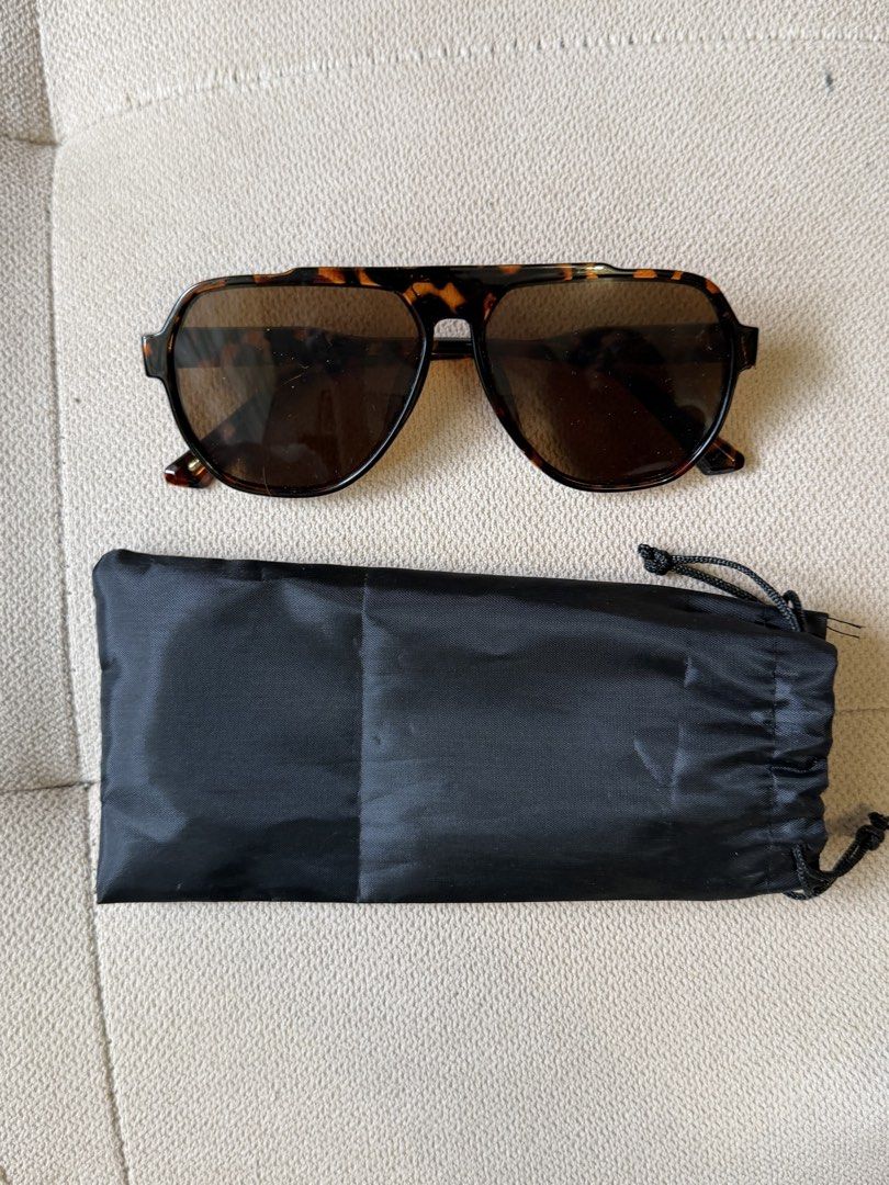 Tortoise shell aviator sunglasses with black pouch (Category: Sunglasses & Eyewear) located in Pasig City. Submitted by miss_abuelita (Listing ID 1465975413, Image 2). Description: - Style: Flat top aviator sunglasses - Color: Tortoise shell frame with brown tinted lenses - Design: Unisex, ideal for everyday wear - Inclusion: Free black drawstring pouch for storage.