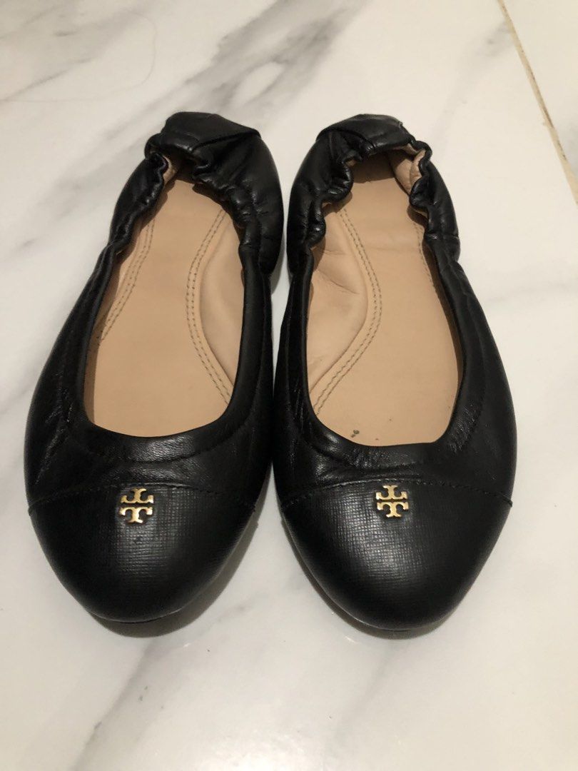 Tory Burch Black Leather Ballet Flats Size 7C (Category: Flats & Sandals) located in Manila. Submitted by janmichael26601 (Listing ID 1466104219, Image 1). Description: - Brand: Tory Burch - Style: Black leather ballet flats with slip-on design and elasticized heel - Details: Signature gold-tone logo hardware on the toe, beige leather lining - Size: 7C - Origin: Made in Dominican Republic - Condition: Clean, with minimal wear on the soles.