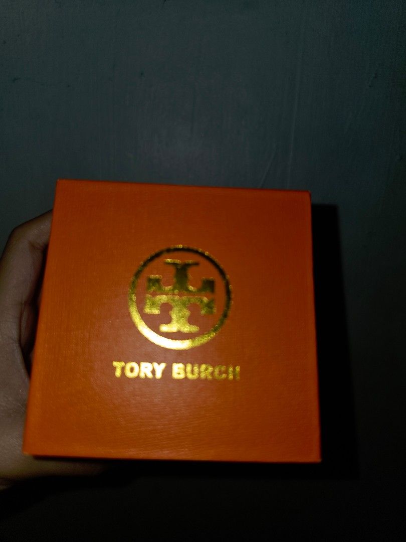 Tory Burch TBW9063 Two-Tone Watch (Category: Women's Watches) located in Manila. Submitted by _sj1204 (Listing ID 1466127618, Image 2). Description: - Brand: Tory Burch - Model: TBW9063 - Condition: Brand new and unworn, still attached to the original display cushion - Design: Two-tone bracelet in silver and gold with a round silver sunray dial - Inclusions: Original orange Tory Burch gift box and product tag included - Perfect for daily elegance
