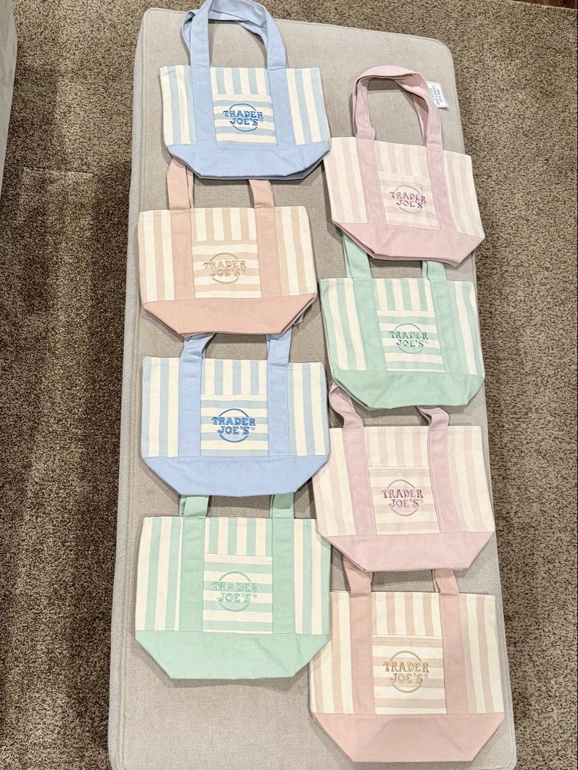 Trader Joe's Mini Canvas Tote Bag Striped (Category: Tote Bags) located in Manila. Submitted by akari_kin (Listing ID 1466150333, Image 1). Description: Pink: Available ✅ Tan: Sold Blue: Sold Green: Sild Authentic Trader Joe's mini canvas tote bag summer edition available in light blue, mint green, pink, and tan. Features a striped pattern, front pocket with embroidered logo, and sturdy double top handles. Perfect size for daily errands. Brand ne