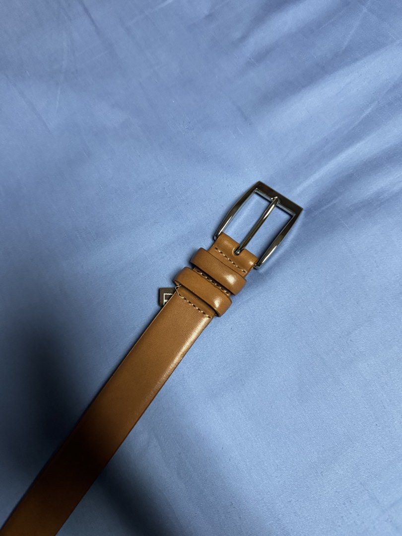Trafalgar Genuine Leather Belt Brown (Category: Belts) located in Manila. Submitted by seangoart (Listing ID 1466055372, Image 1). Description: - Brand: Trafalgar (Norwalk, Connecticut) - Material: Genuine leather in rich brown - Hardware: Classic silver-tone metal buckle - Features: Double leather loops and multiple sizing holes - Style: Simple, clean design ideal for office and smart casual wear.
