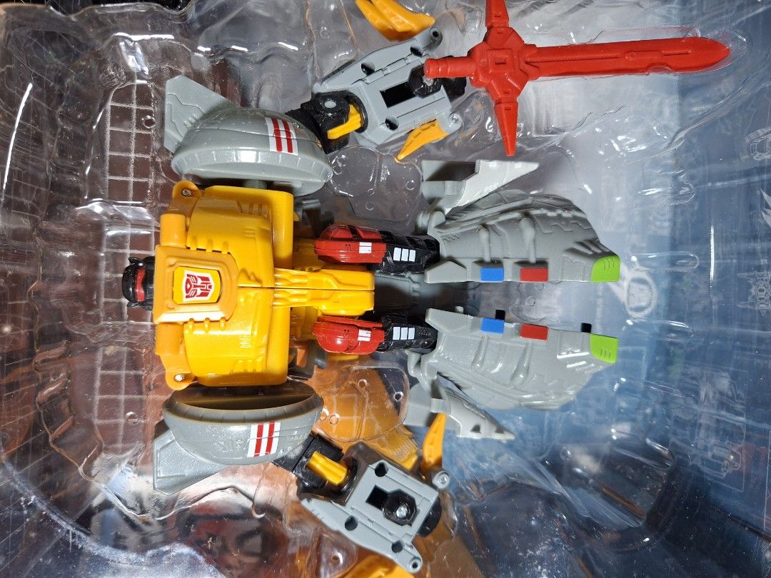 Transformers Evolution 2-Pack Grimlock 1984 & 2014 Toys R Us Exclusive (Category: Action & Battle Toys) located in Baguio. Submitted by restyrille77846 (Listing ID 1465984261, Image 3). Description: - Toys R Us Exclusive Transformers Evolution 2-pack - Features Grimlock from 1984 and 2014 Age of Extinction - Includes original plastic tray packaging, instructions, and red sword accessory - Box shows light shelf wear on the red and white outer pack