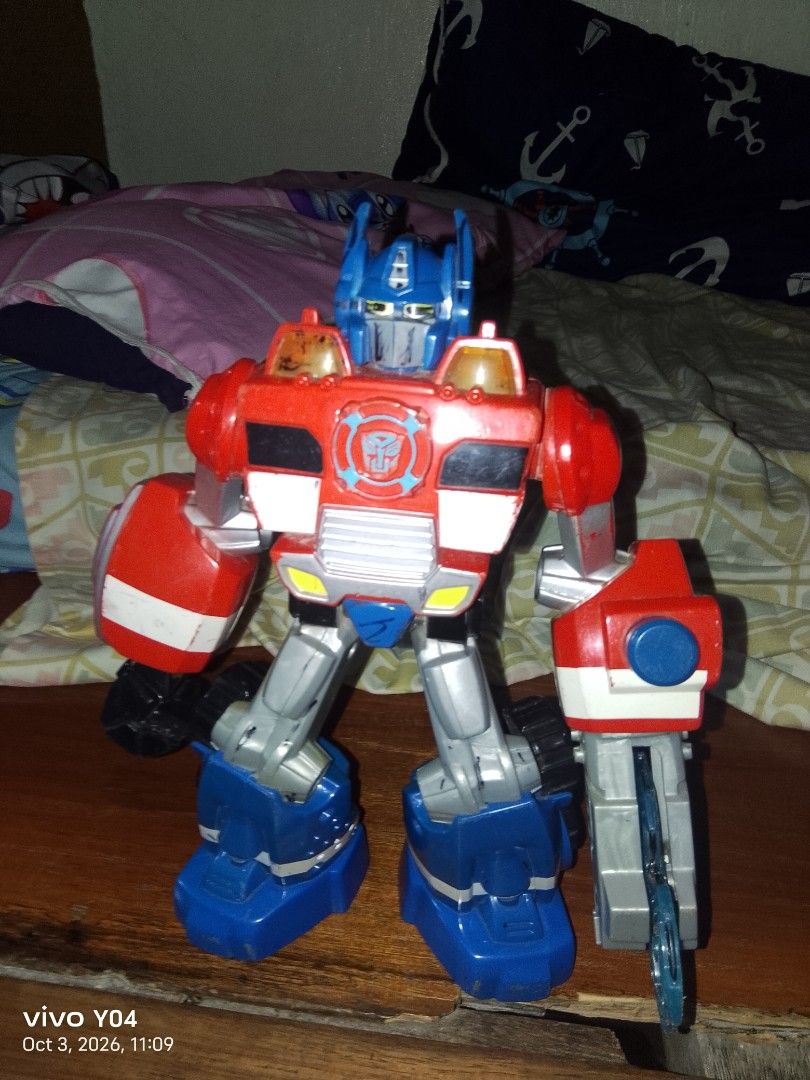 Transformers Optimus Prime Robot Toy (Category: Action & Battle Toys) located in Manila. Submitted by mysticriver.bbd2c5 (Listing ID 1466120891, Image 1). Description: - Item: Transformers Optimus Prime Action Figure - Colors: Red, blue, and silver - Design: Big, bulky build with visible wheels on the back and legs, and Autobot symbol on the chest - Condition: for display only not working.