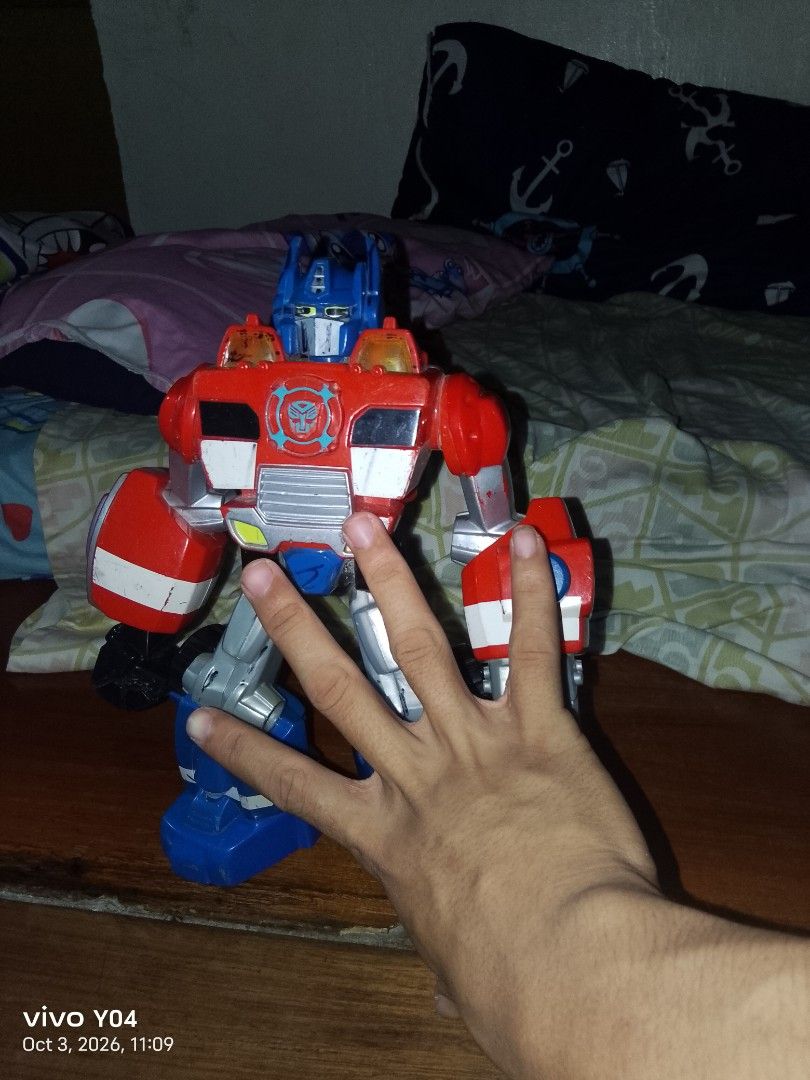 Transformers Optimus Prime Robot Toy (Category: Action & Battle Toys) located in Manila. Submitted by mysticriver.bbd2c5 (Listing ID 1466120891, Image 2). Description: - Item: Transformers Optimus Prime Action Figure - Colors: Red, blue, and silver - Design: Big, bulky build with visible wheels on the back and legs, and Autobot symbol on the chest - Condition: for display only not working.