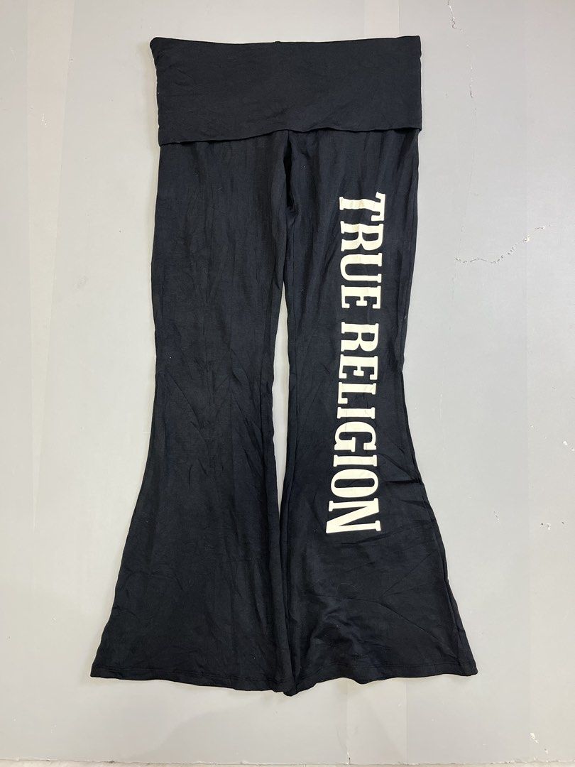 True Religion Foldover Flared Pants Black Medium (Category: Jeans) located in Mabalacat. Submitted by aas_thriftfings (Listing ID 1465992202, Image 1). Description: - Brand: True Religion - Style: Black flared pants with foldover waistband - Detail: White vertical text graphic on left leg - Size: Medium (Waist: 30-32 inches, Length: 37 inches) - Material: Soft, stretchy cotton, modal, and spandex blend - Condition: Excellent.