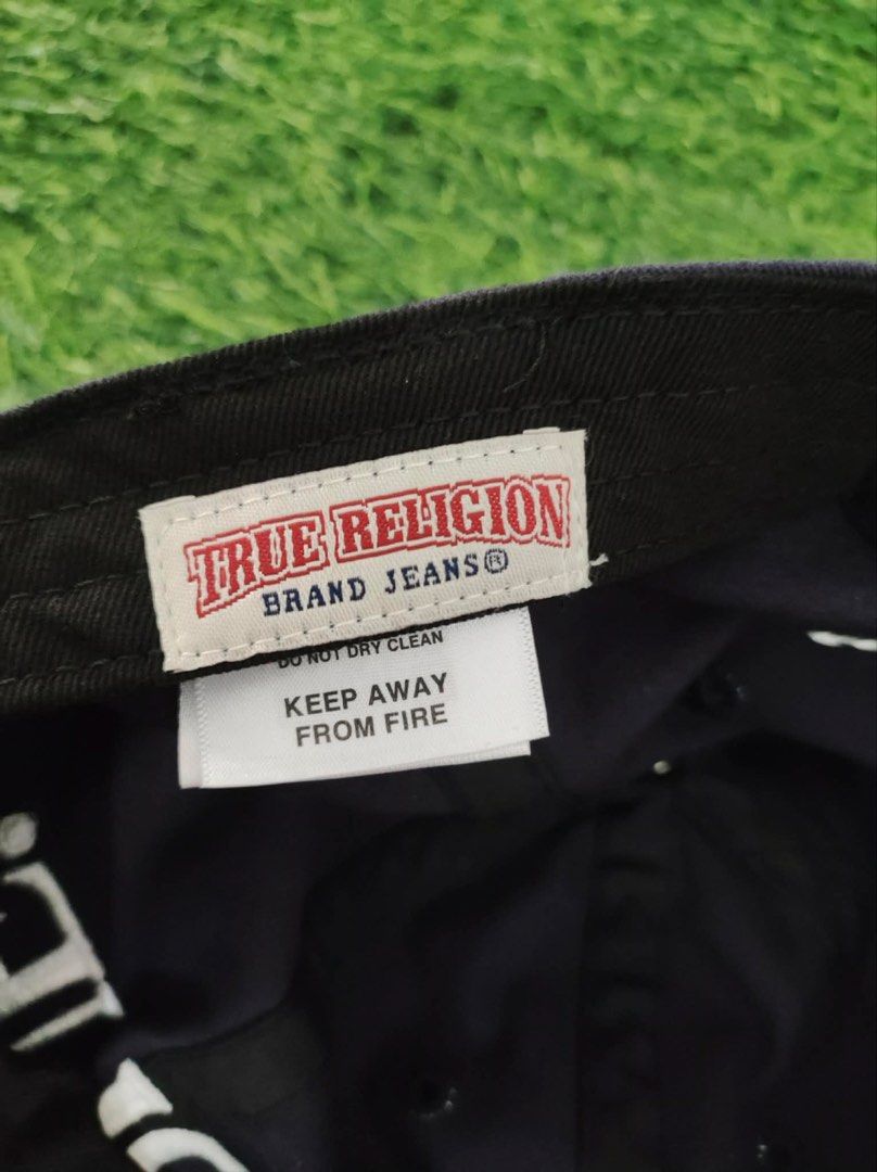 True Religion Navy Blue Baseball Cap (Category: Caps & Hats) located in Makati City. Submitted by rare_thrift_stuff (Listing ID 1465970679, Image 2). Description: - Authentic True Religion baseball cap in classic navy blue - Bold white embroidered 'TRUE' lettering on the front with crossed stitch detail on the back - Adjustable strapback closure fitted with a secure metallic buckle - Crafted from 100% premium cotton (Made in Korea) - Free size fi
