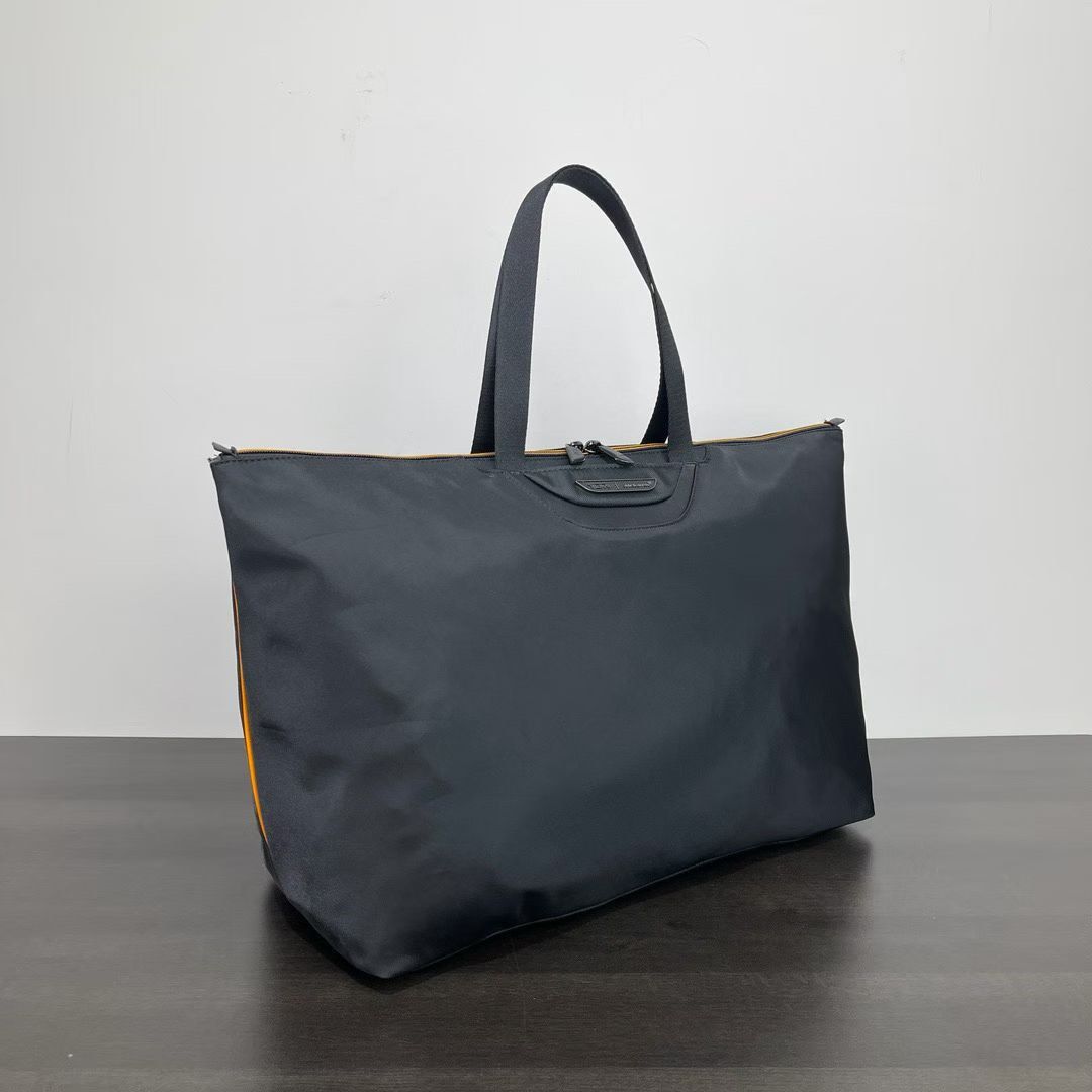 Tumi Mclaren Just in Case Tote (Category: Tote Bags) located in Manila. Submitted by bagmaniaph (Listing ID 1466126098, Image 2). Description: Designed to be completely packable, the Just In Case tote bag from TUMI’s collection folds flat for maximum convenience. It can also be stored within its accompanying pouch. This premium take on our popular Just In Case® tote features McLaren’s automotive-inspired design. It folds flat for easy storage ins
