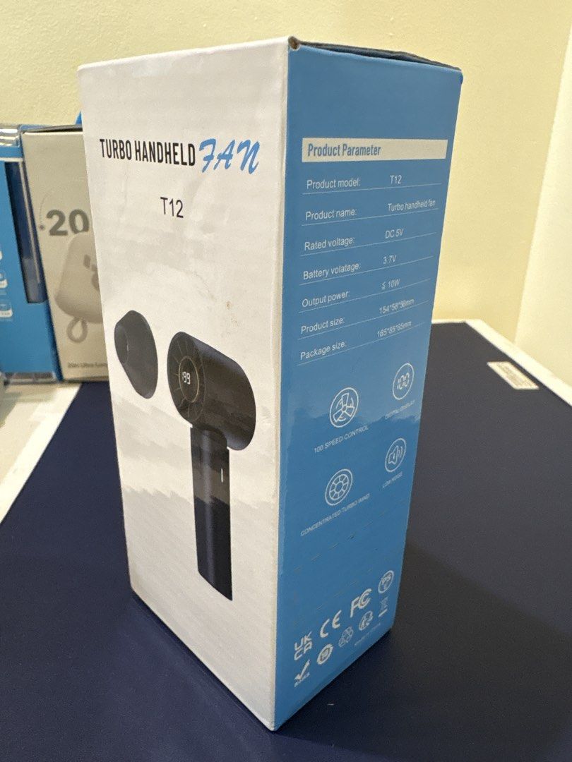 Turbo Handheld Fan T12 Digital Display (Category: Fans) located in Manila. Submitted by dobronxsglazer (Listing ID 1466048910, Image 1). Description: Turbo handheld fan model T12 in black. 100 speed control settings with a digital display showing battery percentage. Concentrated turbo wind with low noise operation. Output power up to 10W, DC 5V rated voltage, 3.7V battery. Compact size, easy to carry around in a bag. Original box included. - Cone