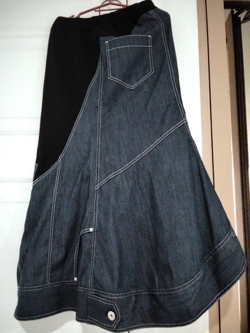 UN3D. Contrast Panel Denim Midi Skirt (Category: Skirts) located in Manila. Submitted by jeansuaco942346 (Listing ID 1465965888, Image 1). Description: - Brand: UN3D. (MARK STYLER) - Design: Denim and black fabric panel skirt with asymmetric buttoned hem - Details: Contrast white stitching, back pocket, and comfortable elastic waistband - Material: Cotton, polyester, and polyurethane blend - Origin: Made in China.