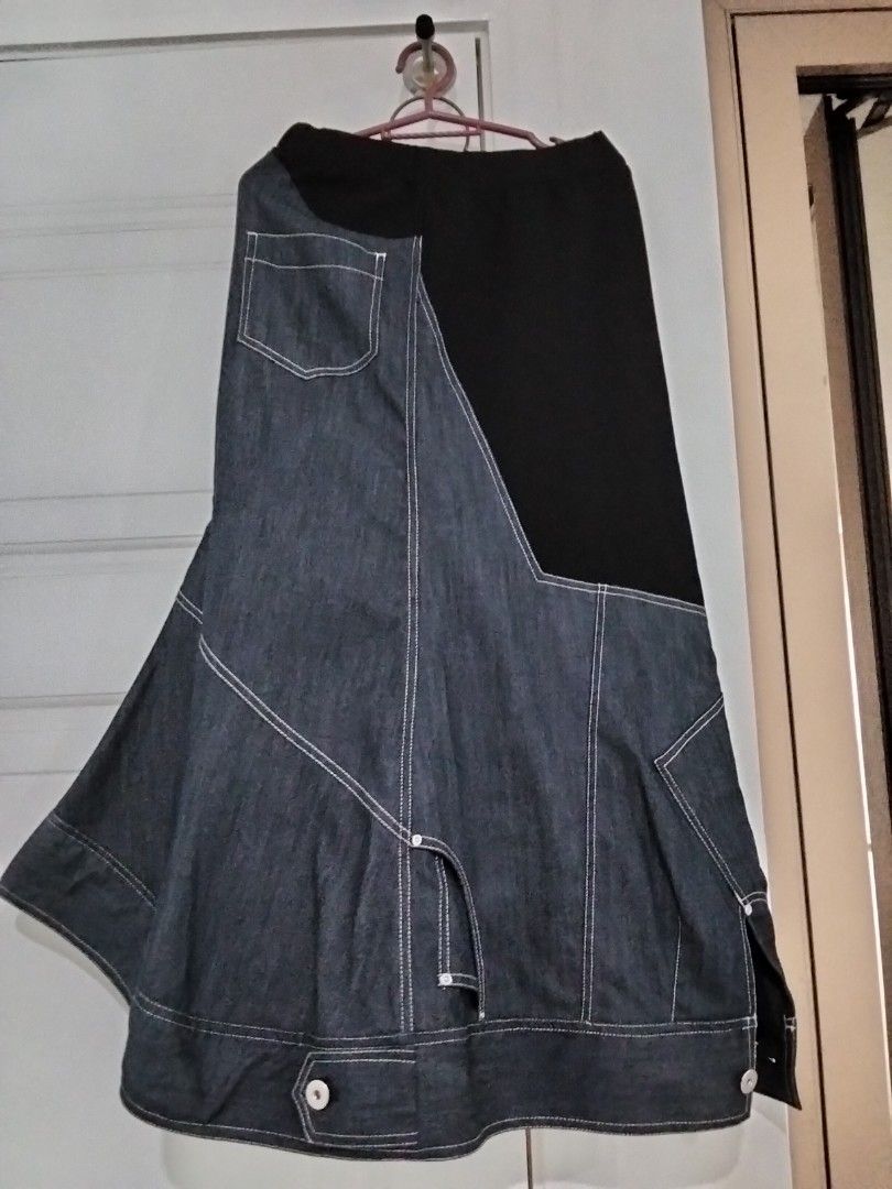 UN3D. Contrast Panel Denim Midi Skirt (Category: Skirts) located in Manila. Submitted by jeansuaco942346 (Listing ID 1465965888, Image 3). Description: - Brand: UN3D. (MARK STYLER) - Design: Denim and black fabric panel skirt with asymmetric buttoned hem - Details: Contrast white stitching, back pocket, and comfortable elastic waistband - Material: Cotton, polyester, and polyurethane blend - Origin: Made in China.