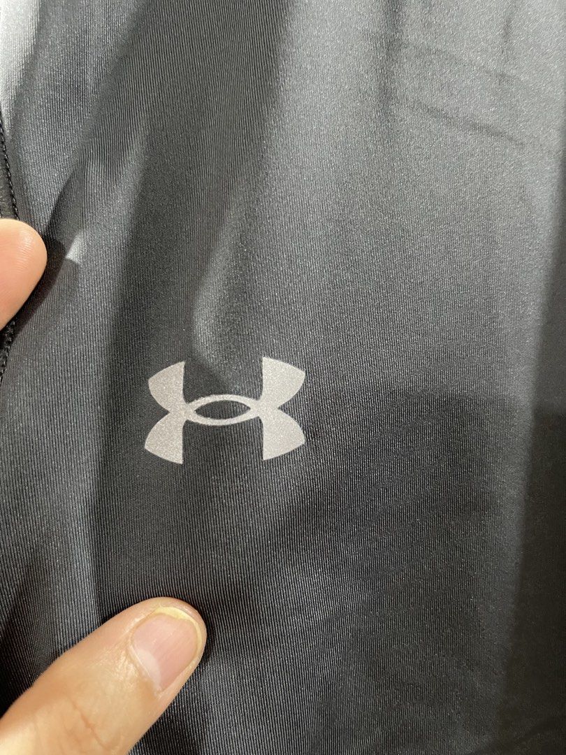 Under Armour Compression Leggings Grey Large (Category: Activewear) located in Quezon City. Submitted by minethenyours18 (Listing ID 1465957867, Image 2). Description: Under Armour compression leggings in solid dark grey. Size large with a stretchy waistband. Flat measurements show about 14 inches across the waist. Iconic reflective Under Armour logo stamped on the upper leg. Made in Jordan. Great activewear piece for workouts, gym sessions, or r