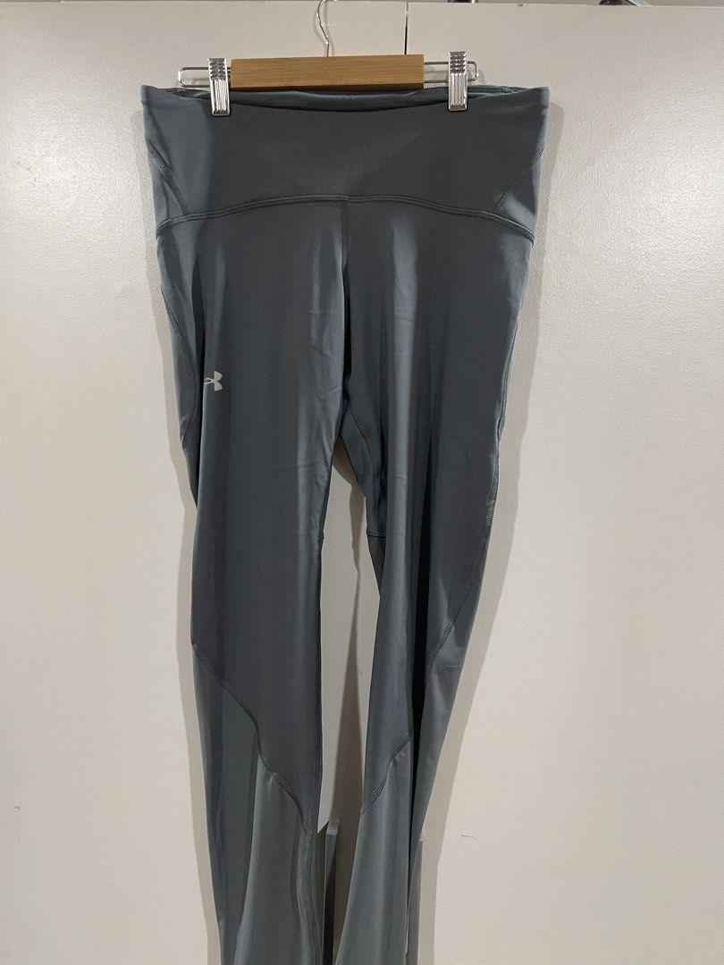Under Armour Compression Leggings Grey Large (Category: Activewear) located in Quezon City. Submitted by minethenyours18 (Listing ID 1465957867, Image 1). Description: Under Armour compression leggings in solid dark grey. Size large with a stretchy waistband. Flat measurements show about 14 inches across the waist. Iconic reflective Under Armour logo stamped on the upper leg. Made in Jordan. Great activewear piece for workouts, gym sessions, or r