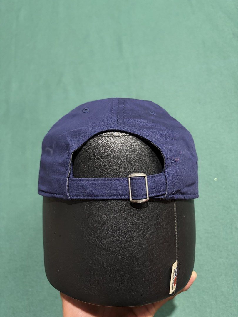 Under Armour Navy Blue Baseball Cap Hat (Category: Caps & Hats) located in Guihulngan. Submitted by fbthriftgoodsniace (Listing ID 1466014163, Image 3). Description: - Brand: Under Armour - Color: Classic Navy Blue - Design: 6-panel structure with embroidered white logo on the side - Brim: Clean, curved design - Closure: Adjustable strapback with silver metal hardware - Condition: Brand new / Excellent - Best for: Gym workouts, sports, or everyda
