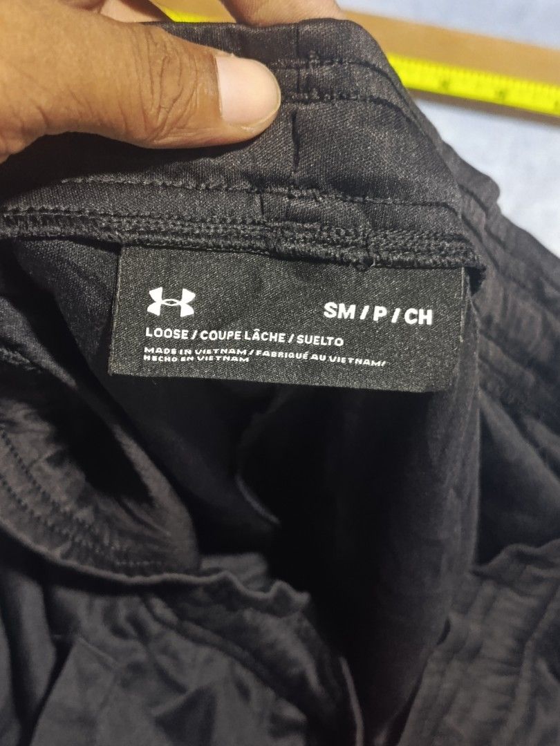 Under Armour Performance Apparel Black Shorts Size S (Category: Shorts) located in City of Isabela. Submitted by warmbird.d06e6f (Listing ID 1465969989, Image 3). Description: - Brand: Under Armour - Color: Black with striking neon orange logo and matching drawstring - Fit: Loose fit with a comfortable elastic waistband - Fabric: Lightweight and breathable - Origin: Made in Vietnam - Ideal for: Workouts, running, or everyday casual wear.