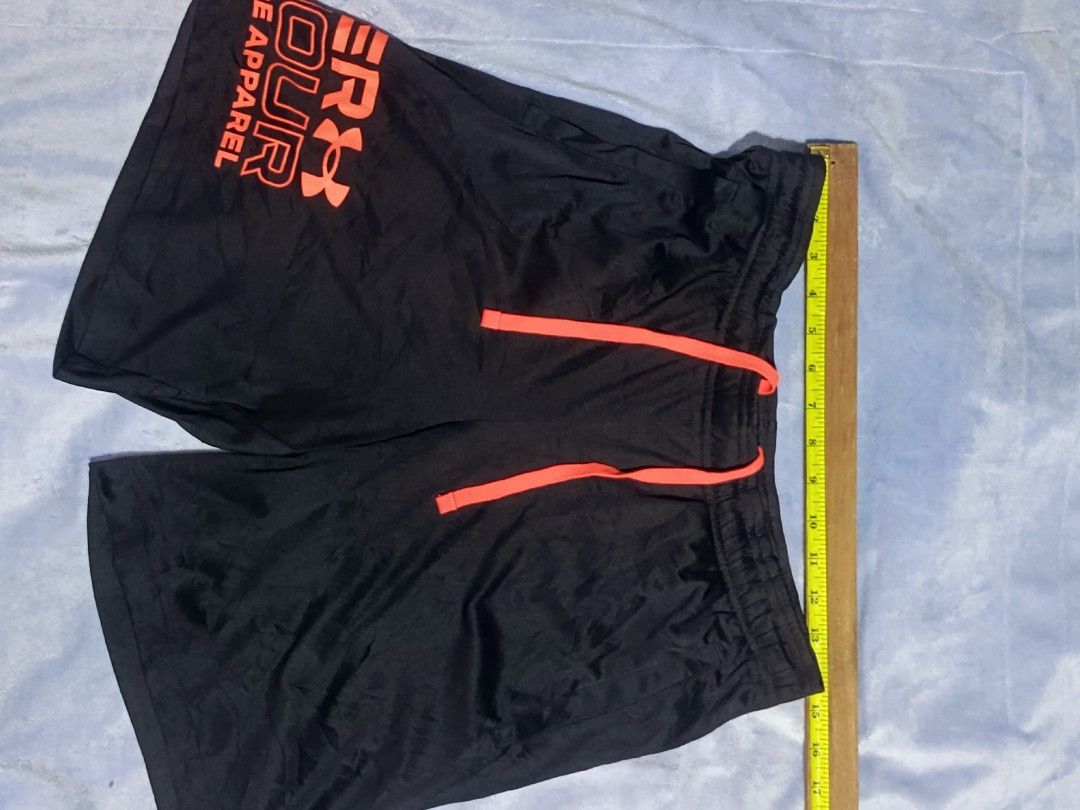 Under Armour Performance Apparel Black Shorts Size S (Category: Shorts) located in City of Isabela. Submitted by warmbird.d06e6f (Listing ID 1465969989, Image 1). Description: - Brand: Under Armour - Color: Black with striking neon orange logo and matching drawstring - Fit: Loose fit with a comfortable elastic waistband - Fabric: Lightweight and breathable - Origin: Made in Vietnam - Ideal for: Workouts, running, or everyday casual wear.