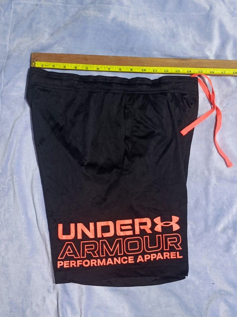 Under Armour Performance Apparel Black Shorts Size S (Category: Shorts) located in City of Isabela. Submitted by warmbird.d06e6f (Listing ID 1465969989, Image 2). Description: - Brand: Under Armour - Color: Black with striking neon orange logo and matching drawstring - Fit: Loose fit with a comfortable elastic waistband - Fabric: Lightweight and breathable - Origin: Made in Vietnam - Ideal for: Workouts, running, or everyday casual wear.