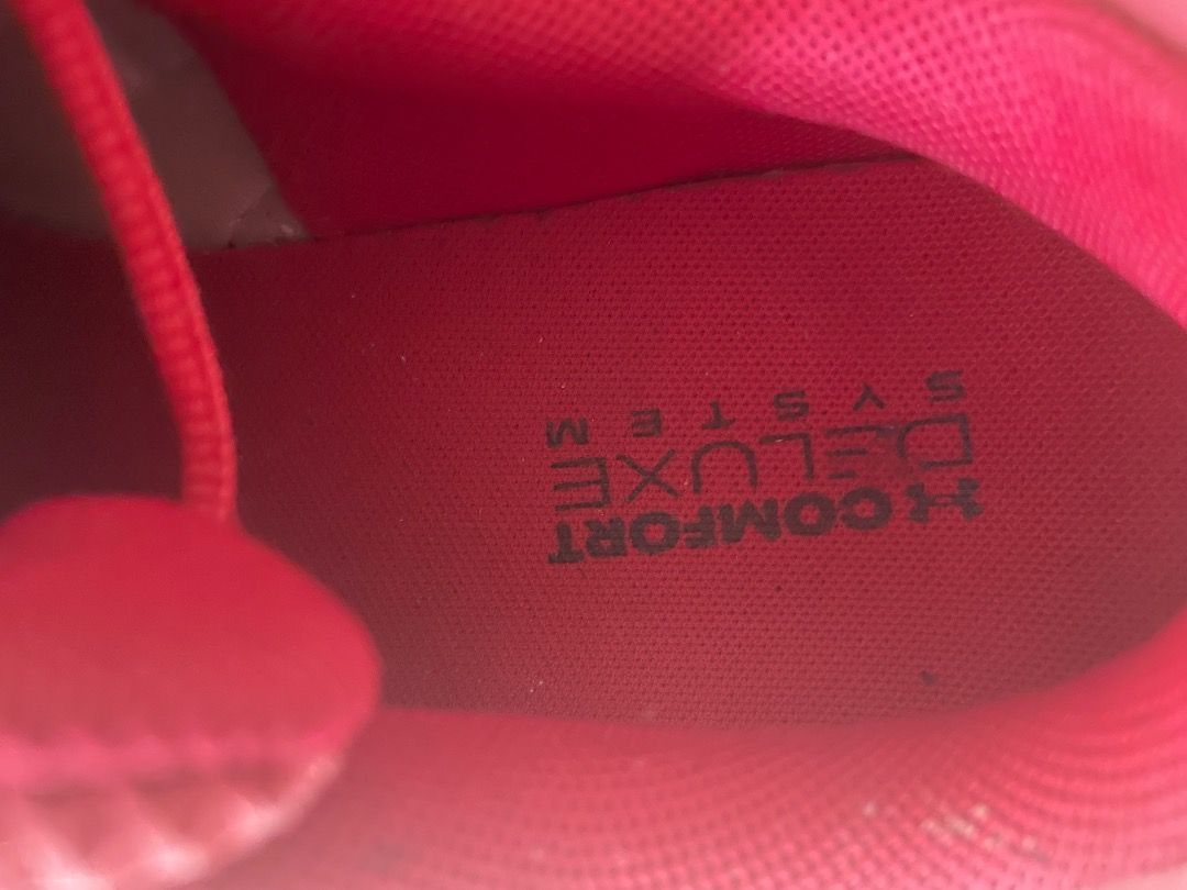 Under Armour Red Running Shoes Size US 8 (Category: Sneakers) located in Cavite. Submitted by mikah0711 (Listing ID 1466082104, Image 3). Description: - Brand: Under Armour - Color: Bright red with white soles - Size: US 8 / UK 7 / EUR 41 / CM 26 - Features: Breathable mesh upper, Comfort Deluxe System insoles, and convenient back pull tabs - Condition: Pre-owned with visible scuffs on the white rubber midsoles and normal wear on the bottom tread