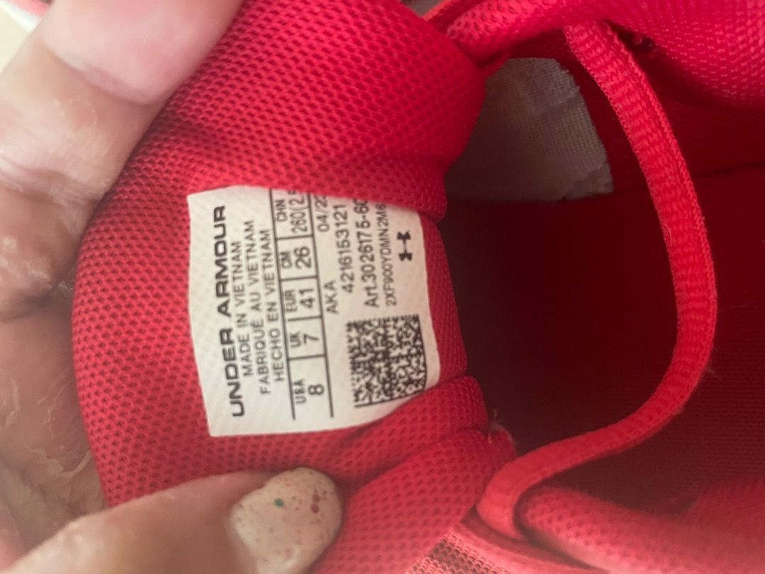 Under Armour Red Running Shoes Size US 8 (Category: Sneakers) located in Cavite. Submitted by mikah0711 (Listing ID 1466082104, Image 2). Description: - Brand: Under Armour - Color: Bright red with white soles - Size: US 8 / UK 7 / EUR 41 / CM 26 - Features: Breathable mesh upper, Comfort Deluxe System insoles, and convenient back pull tabs - Condition: Pre-owned with visible scuffs on the white rubber midsoles and normal wear on the bottom tread