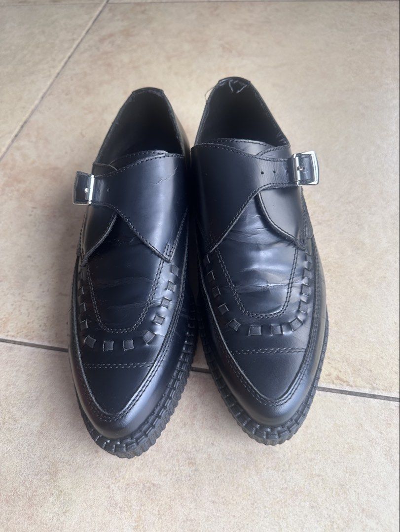 Underground Black Leather Monk Strap Creepers (Category: Casual Shoes) located in Paranaque City. Submitted by jjim000 (Listing ID 1465993386, Image 1). Description: Underground brand creeper shoes in black leather. Single buckle monk strap design with woven front detailing. Pointed toe silhouette and thick ribbed platform sole. Branded insole visible inside. Light creasing. Soles remain thick and intact with minimal heel drag. Classic punk rock 