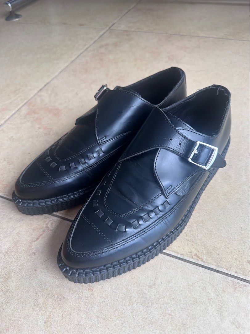 Underground Black Leather Monk Strap Creepers (Category: Casual Shoes) located in Paranaque City. Submitted by jjim000 (Listing ID 1465993386, Image 2). Description: Underground brand creeper shoes in black leather. Single buckle monk strap design with woven front detailing. Pointed toe silhouette and thick ribbed platform sole. Branded insole visible inside. Light creasing. Soles remain thick and intact with minimal heel drag. Classic punk rock 