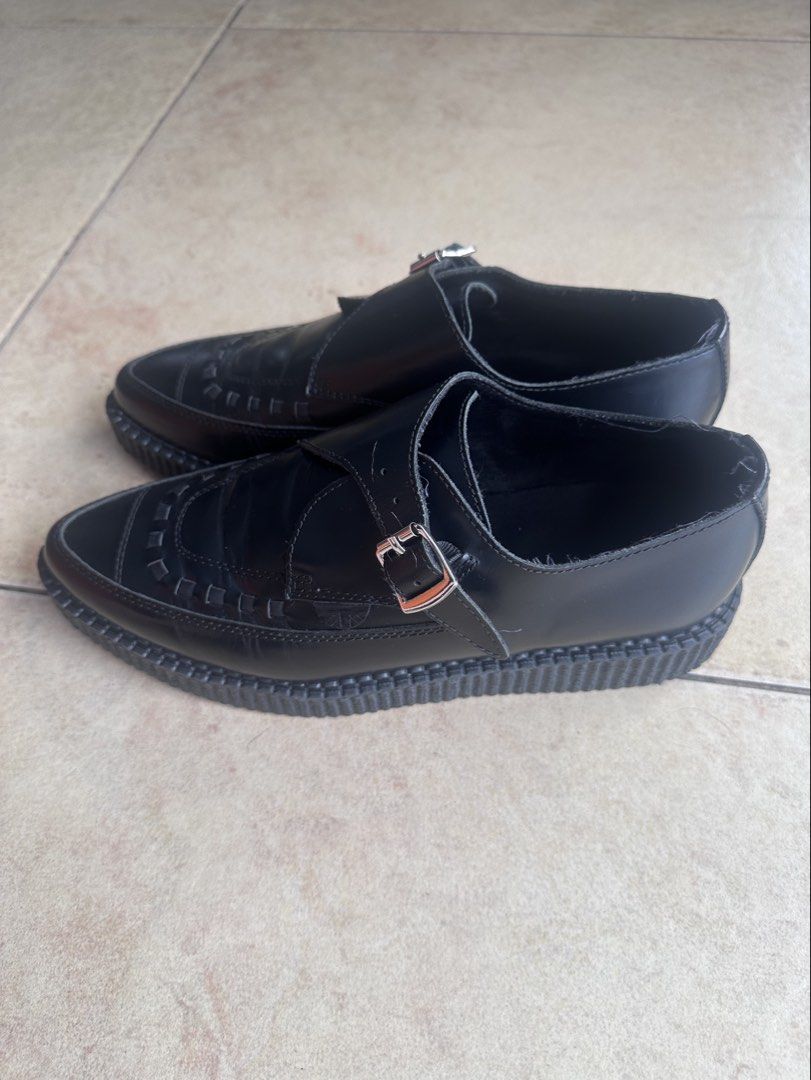 Underground Black Leather Monk Strap Creepers (Category: Casual Shoes) located in Paranaque City. Submitted by jjim000 (Listing ID 1465993386, Image 3). Description: Underground brand creeper shoes in black leather. Single buckle monk strap design with woven front detailing. Pointed toe silhouette and thick ribbed platform sole. Branded insole visible inside. Light creasing. Soles remain thick and intact with minimal heel drag. Classic punk rock 
