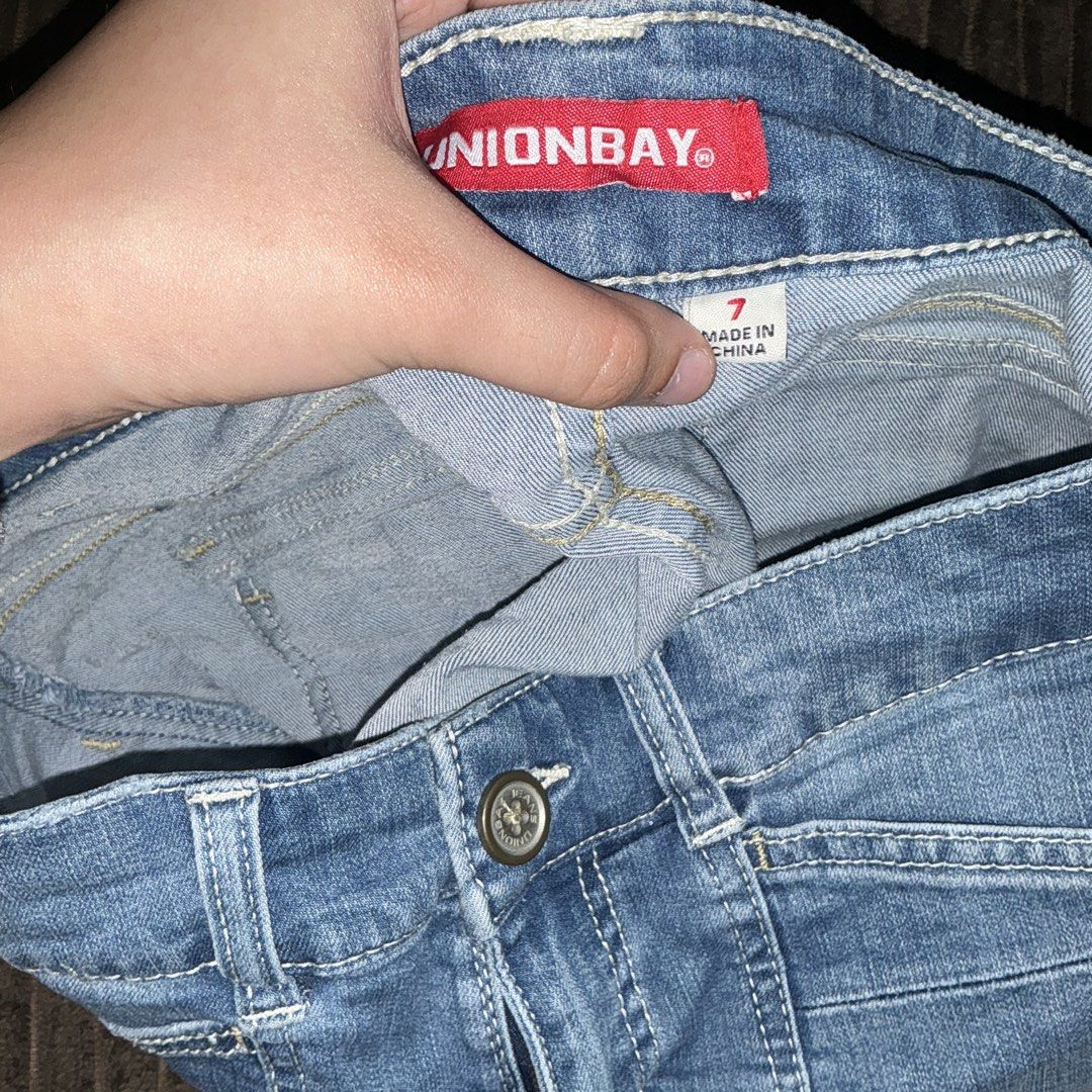 Unionbay Denim Shorts Size 7 (Category: Shorts) located in Quezon City. Submitted by puchi.cat (Listing ID 1465974990, Image 3). Description: - Brand: Unionbay - Size: 7 - Wash: Classic blue - Closure: Zip fly with front button fastening - Pockets: Front pockets and button-flap back pockets - Details: Red Unionbay logo label on the inner waistband and back pocket tag, Semi-stretchy can fit up to 30 waist. - Condition: Great staple piece for warm 