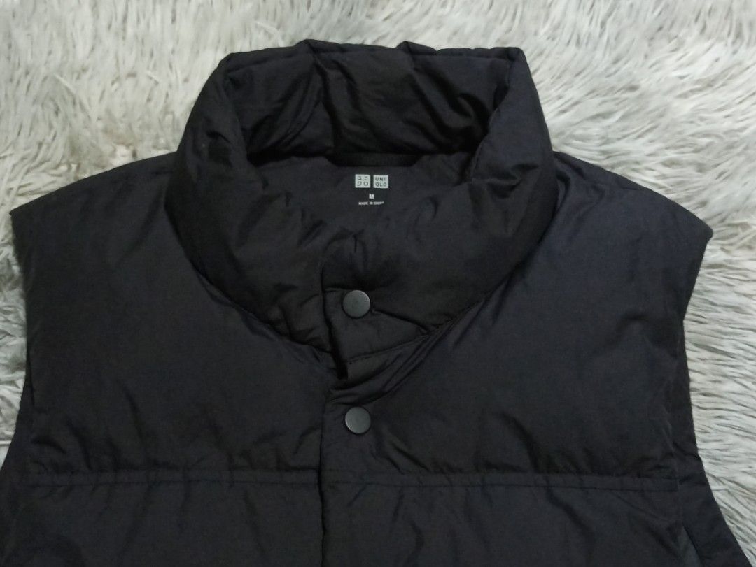 Uniqlo Black Padded Down Vest Size M (Category: Vests) located in Alaminos. Submitted by aj_collection28 (Listing ID 1466077430, Image 2). Description: - Brand/Model: Uniqlo Down Vest - Color: Classic Black - Size: Medium (M) - Dimes: 21.5W x 26L - Material: 90% Down, 10% Feather filling for premium warmth - Design: Quilted puffer with snap button front closure - Pockets: Two functional front pockets - Condition: Good pre-loved winter layering pi