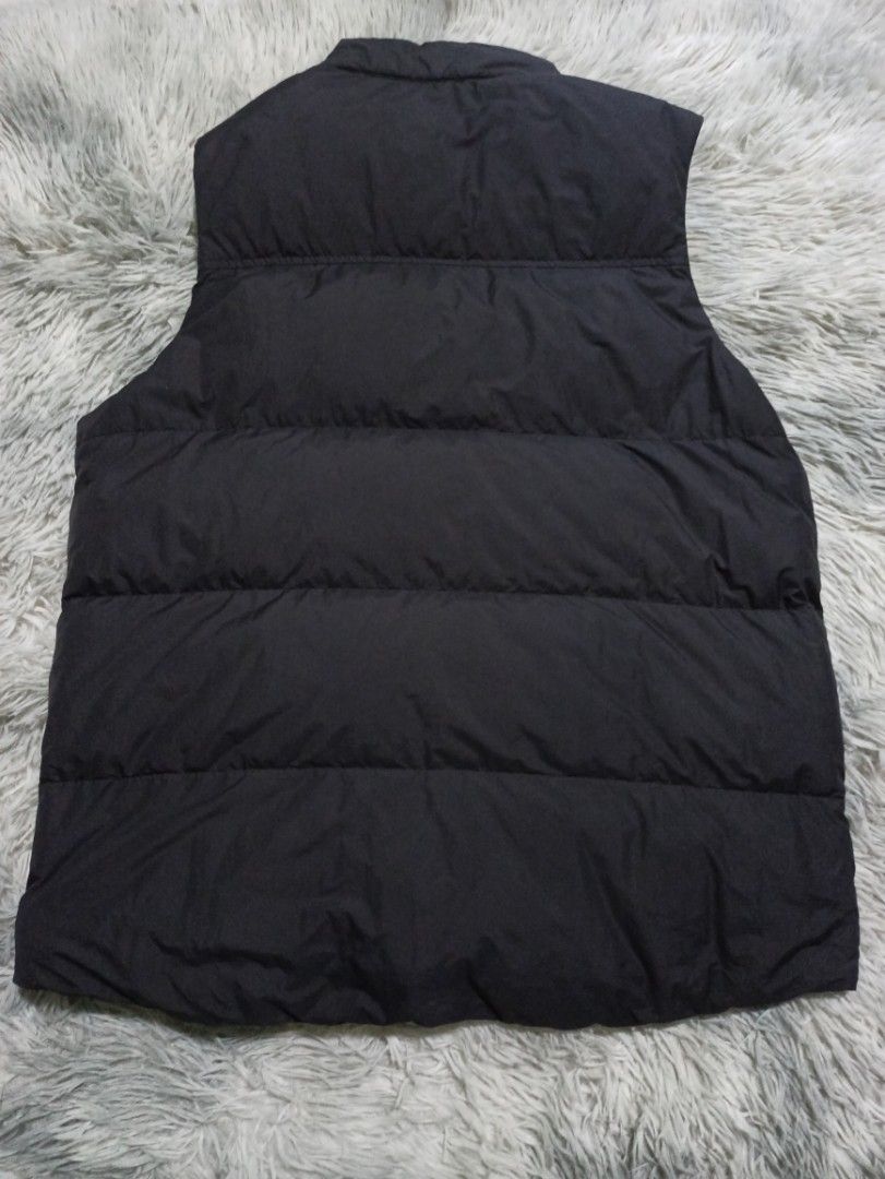 Uniqlo Black Padded Down Vest Size M (Category: Vests) located in Alaminos. Submitted by aj_collection28 (Listing ID 1466077430, Image 3). Description: - Brand/Model: Uniqlo Down Vest - Color: Classic Black - Size: Medium (M) - Dimes: 21.5W x 26L - Material: 90% Down, 10% Feather filling for premium warmth - Design: Quilted puffer with snap button front closure - Pockets: Two functional front pockets - Condition: Good pre-loved winter layering pi