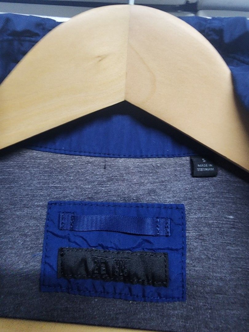 Uniqlo Blue Parka Jacket Size S (Category: Coats, Jackets and Outerwear) located in Manila. Submitted by ybn15 (Listing ID 1466120642, Image 2). Description: - Color: Blue - Pristine color condition - Size: Small (S) - Closure: Front zipper - Features: Hooded, front pockets, stylish grey lining, and button accents - Material: Lightweight outer fabric - Condition: Clean overall look - Best for: Everyday layering and breezy weather.