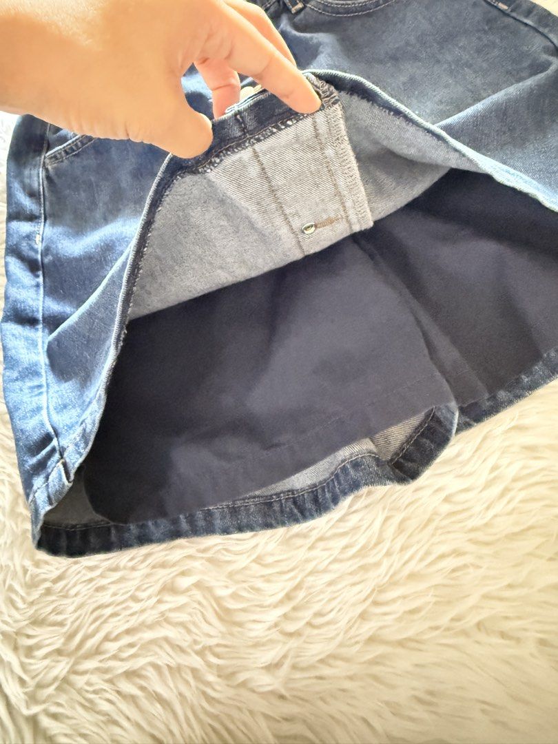 Uniqlo Denim Skort Size S (Category: Skirts) located in Davao. Submitted by keirousel (Listing ID 1466034206, Image 3). Description: - Brand: Uniqlo - Item: Denim skirt with built-in shorts - Color/Wash: Dark blue - Size: 150 (tag inside) - Waistband: Elastic at the back - Closure: Front button closure down the middle - Pockets: Functional pockets on the front.