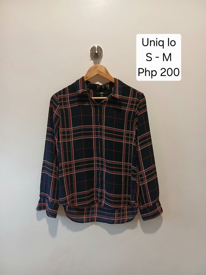 Uniqlo Navy Blue Plaid Button Down Blouse Size M (Category: Blouses) located in Antipolo. Submitted by wisecat.4a7eea (Listing ID 1466043493, Image 1). Description: - Brand: Uniqlo - Item: Plaid Long Sleeve Button-Down Blouse - Color: Navy blue base with red and white plaid pattern - Size: Medium (Bust: 80-86cm, Height: 160/84A) - Material: 100% Polyester - Details: Collared neckline, button front, button cuffs, high-low curved hemline - Conditio