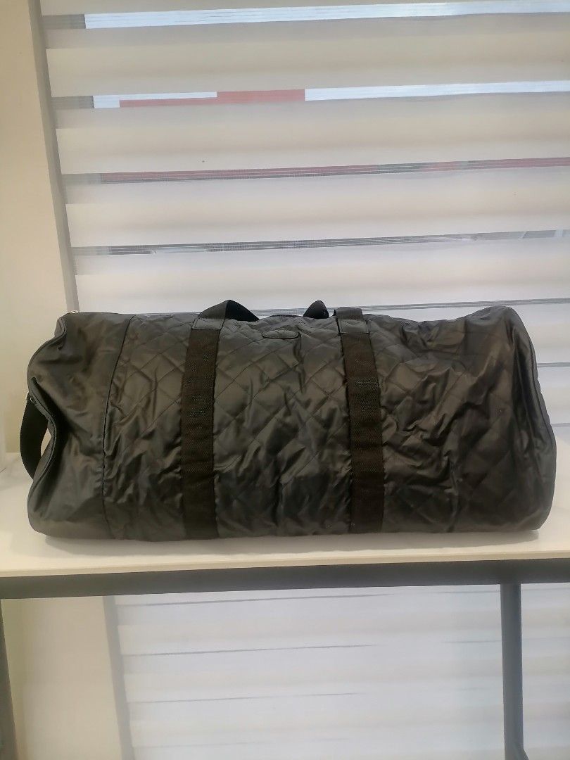 Valentino garavani Black Duffle bag (Category: Luxury Bags & Wallets) located in Digos. Submitted by crodualady82694 (Listing ID 1466047654, Image 3). Description: - Stylish black quilted travel bag with Valentino logo patch and side branding - Spacious zippered main compartment ideal for weekend getaways or the gym - Sturdy top handles and a convenient adjustable shoulder strap for easy carrying - Durable fabric construction that holds its shape