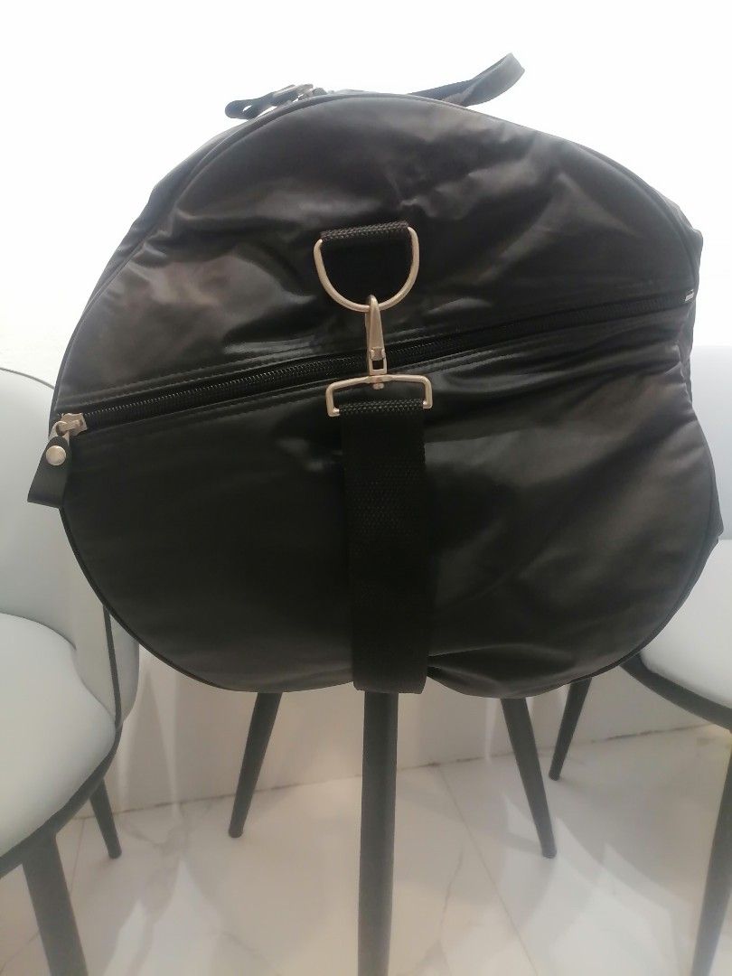Valentino garavani Black Duffle bag (Category: Luxury Bags & Wallets) located in Digos. Submitted by crodualady82694 (Listing ID 1466047654, Image 2). Description: - Stylish black quilted travel bag with Valentino logo patch and side branding - Spacious zippered main compartment ideal for weekend getaways or the gym - Sturdy top handles and a convenient adjustable shoulder strap for easy carrying - Durable fabric construction that holds its shape