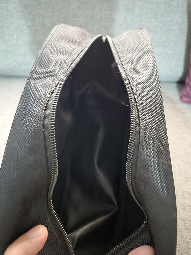 Van Heusen Toiletry Bag Travel Pouch (Category: Purses & Pouches) located in Manila. Submitted by munggomooo (Listing ID 1466023735, Image 3). Description: - Brand: Van Heusen - Color/Material: Dark grey textured fabric - Compartments: Spacious main zip compartment with smooth black lining and front zippered pocket - Portability: Convenient side grab handle for carrying or hanging - Condition: Clean interior and exterior with smooth, working zipp