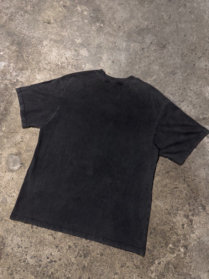 Vancarhell Spider Graphic Distressed T-shirt (Category: Tshirts & Polo Shirts ) located in Pasig City. Submitted by dripthrift1600 (Listing ID 1466098525, Image 2). Description: - Brand: Vancarhell - Size: L - Color: Black with heavy pigment wash - Material: 100% thick, sturdy cotton - Design: Large white spider graphic with typewriter-style text and spiderweb details - Details: Distressed holes on the collar ribbing for a vintage, worn-in aesthe