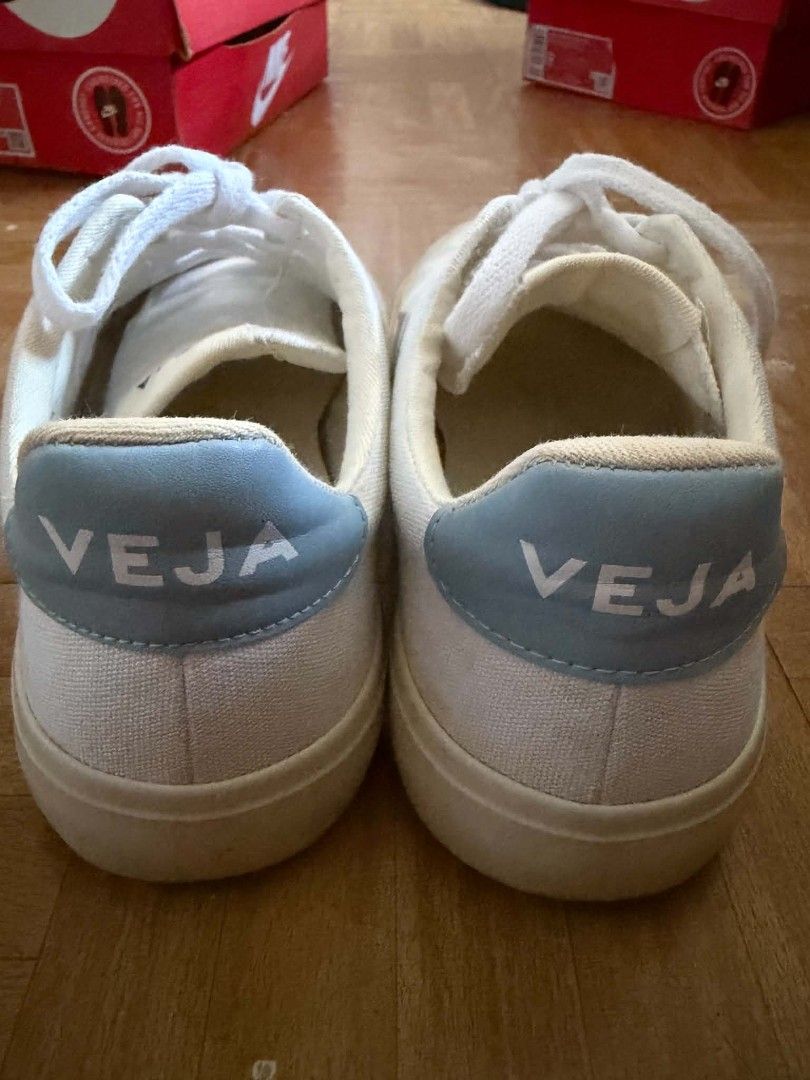 Veja White and Light Blue Canvas Sneakers (Category: Sneakers) located in Manila. Submitted by jigs30 (Listing ID 1465980887, Image 2). Description: - Style: Classic casual white canvas sneakers - Details: Light blue heel tabs and branding on the tongue - Closure: Lace-up with white laces - Soles: Flat soles - Condition: Visible signs of wear on the upper material and inner lining used once.